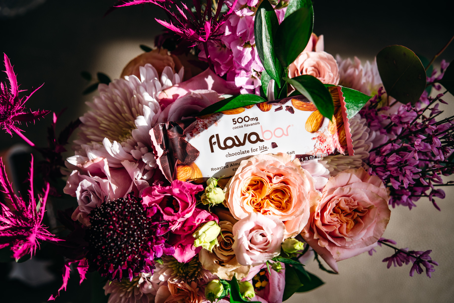 Chocolate almond FlavaBar in a bouquet of pink flowers. 